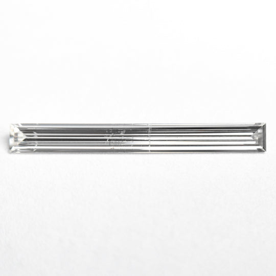 0.52ct 19.44x2.17x1.09mm SI2 E Baguette Step Cut 26545-01