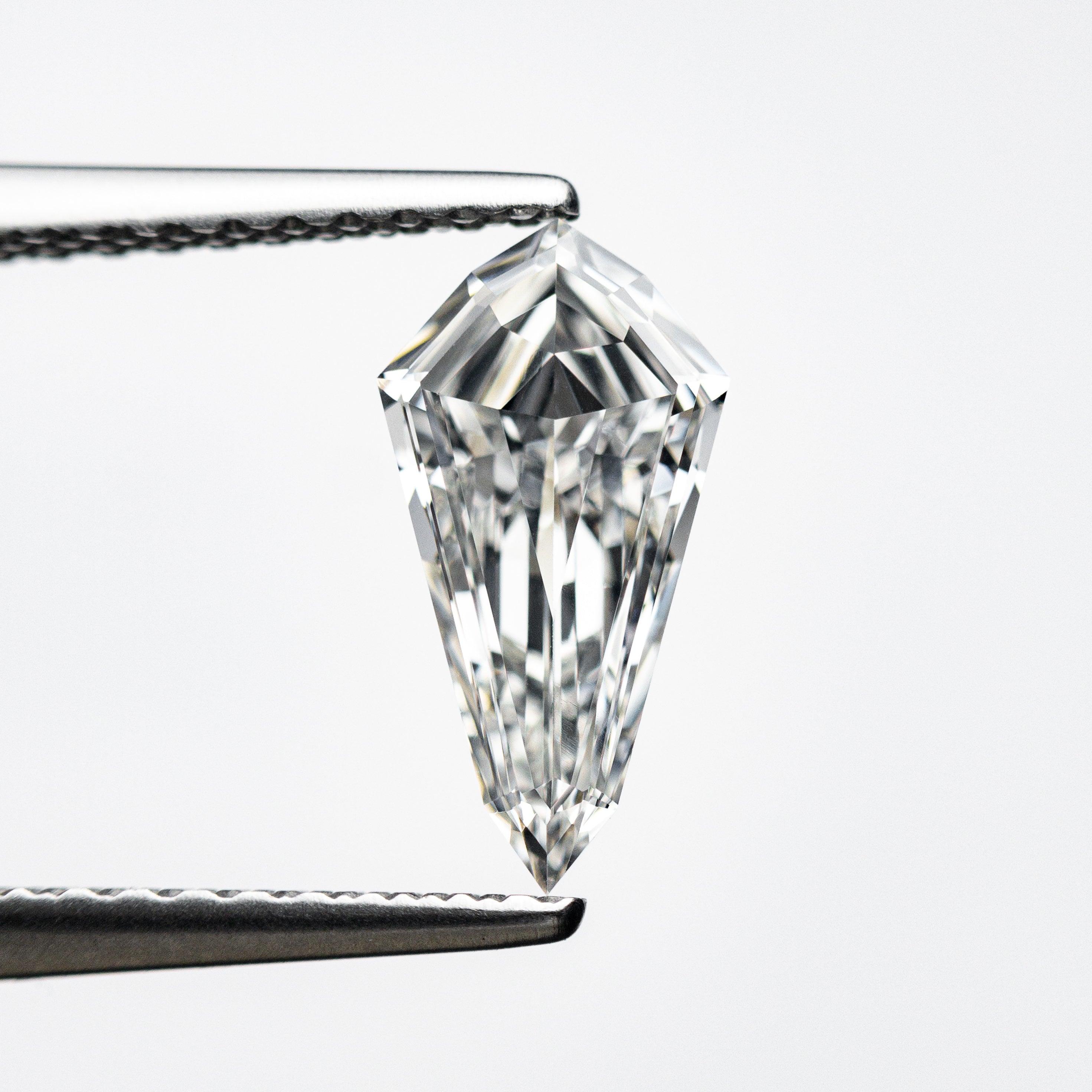 0.71ct 10.00x5.18x2.29mm VS1 F Kite Step Cut 21690-06