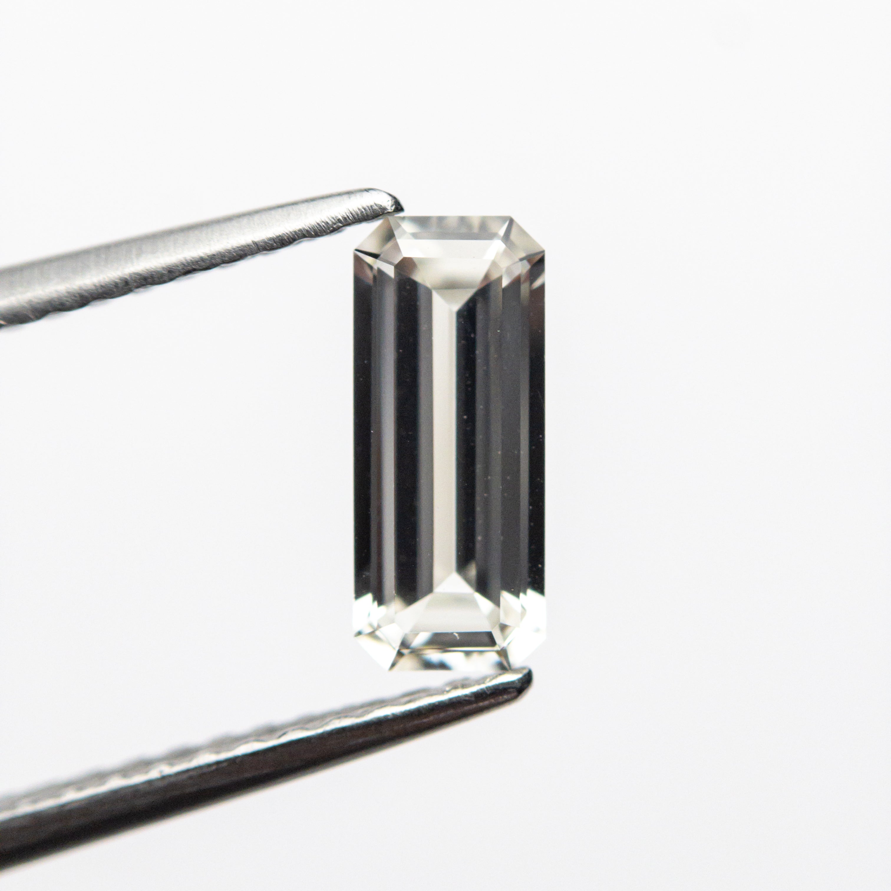 0.71ct 8.30x3.48x2.21mm Cut Corner Rectangle Step Cut Sapphire 22830-01